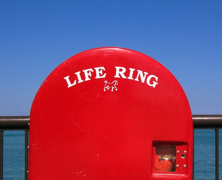 a life ring that is on the side of the water