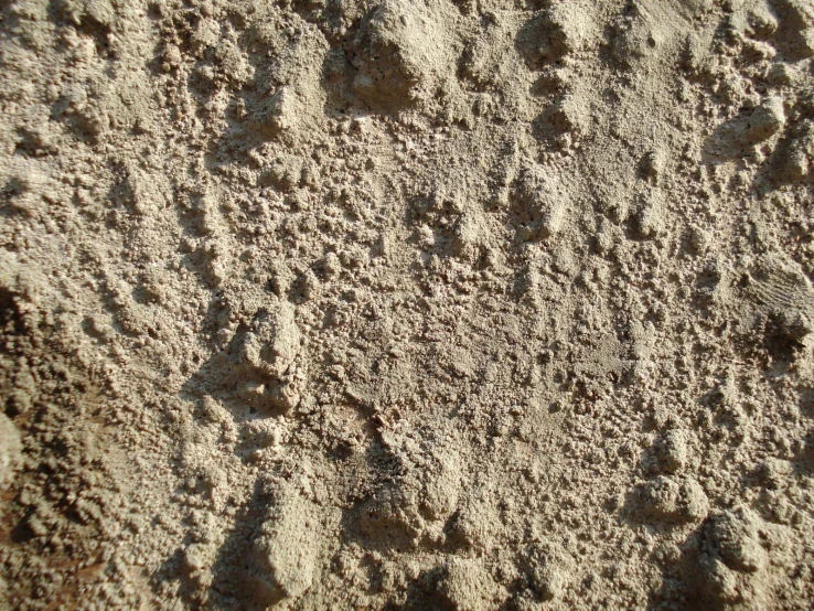 a sandy area with a pattern of sand