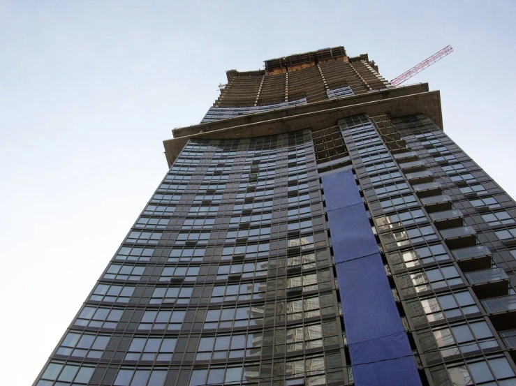 a high rise office building with glass windows