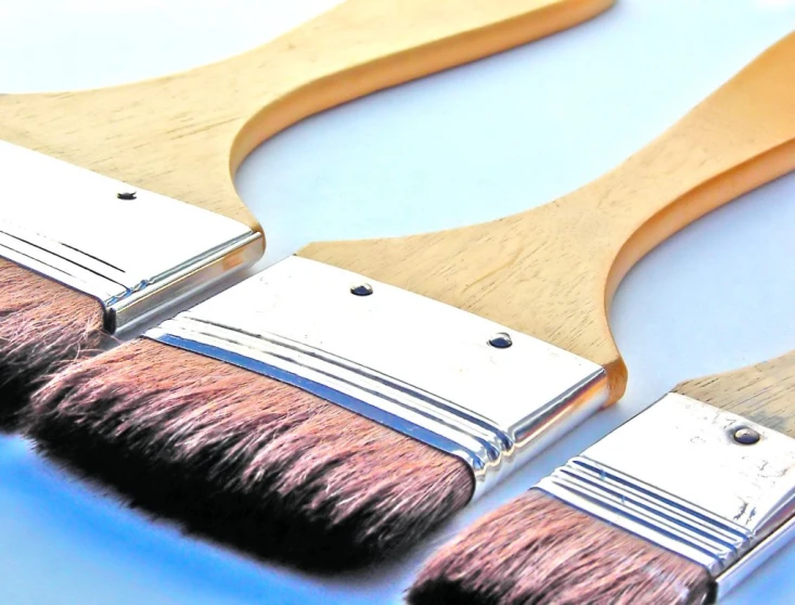 a row of paintbrushes sitting on top of each other