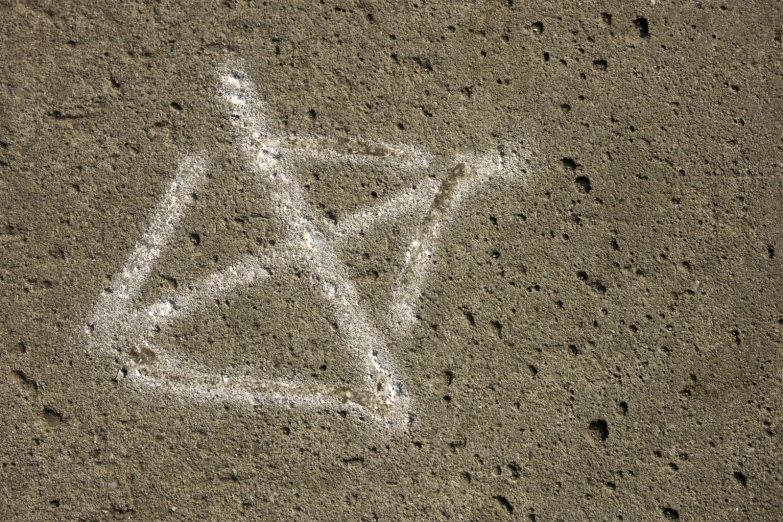 there is a bicycle shaped in the sand