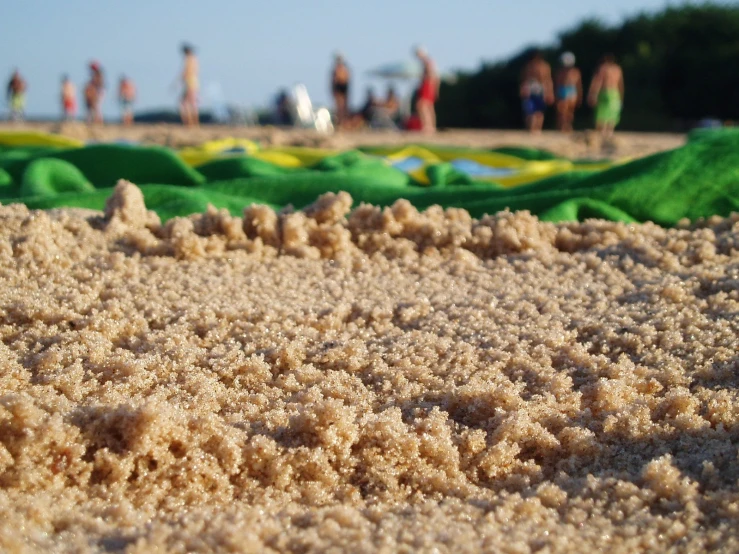 a beach with sand and toys for sale