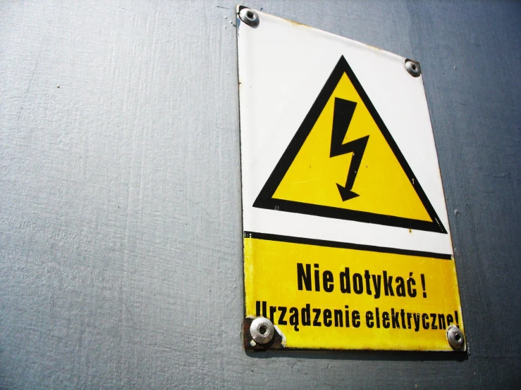 a yellow and white sign warning of a lightning