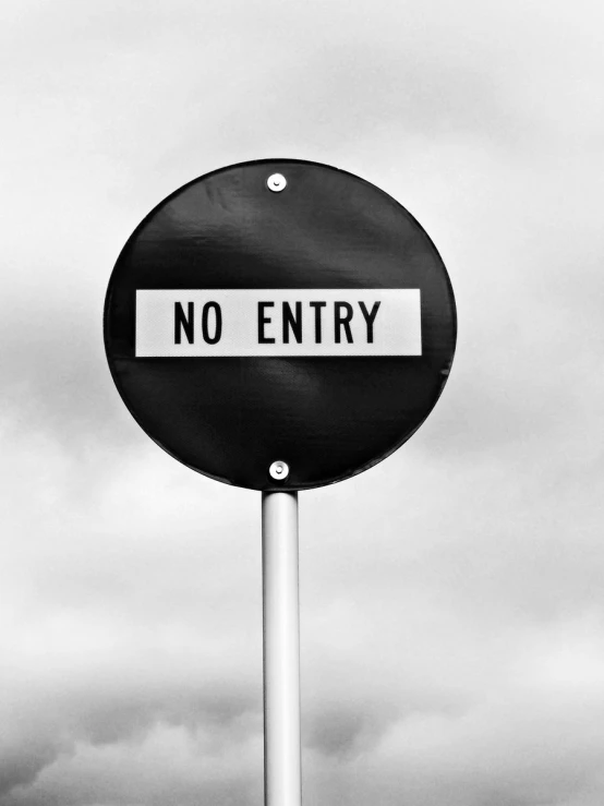 black and white pograph of an'n entry sign