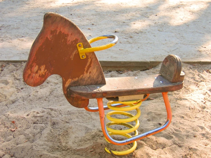 a small toy horse sitting on top of a chair