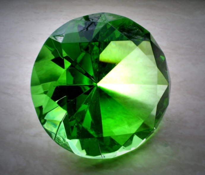 a very big green crystal is sitting on the table