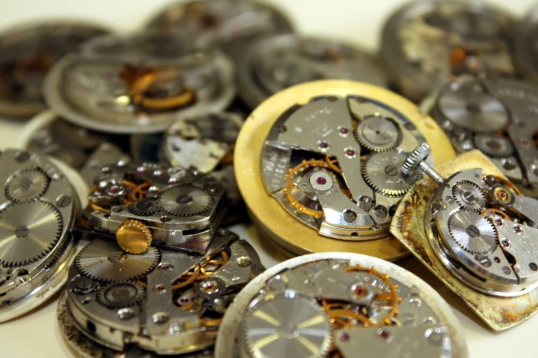 the gears of an open faced pocket watch