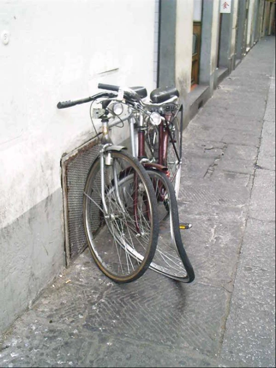 bike leaned on the wall of a street