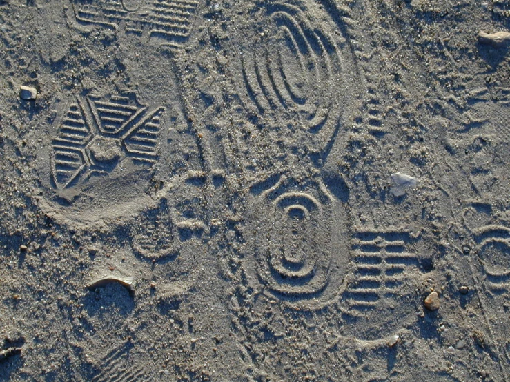 a picture on sand, with the number two and an arrow