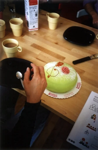someone is decorating a cake with the symbol x on it
