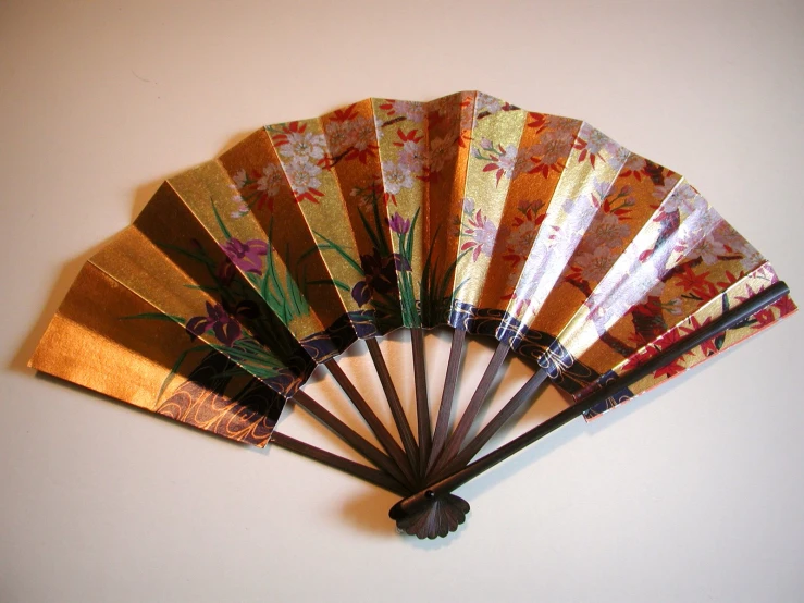 a small wooden fan that is mounted on a wall