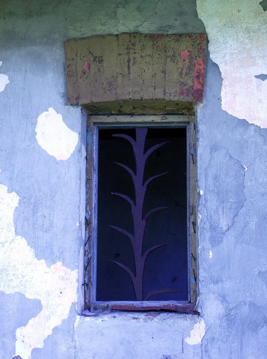 an old fashioned looking building has an ornamental glass design