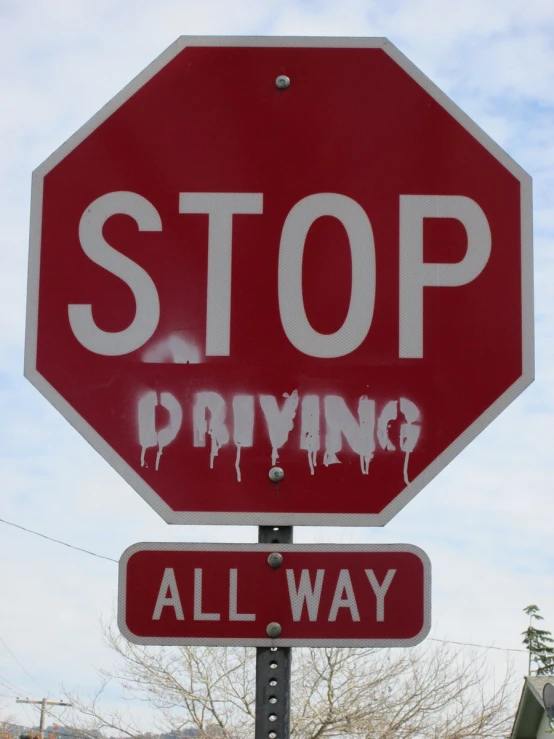 a stop sign that is all covered in graffiti