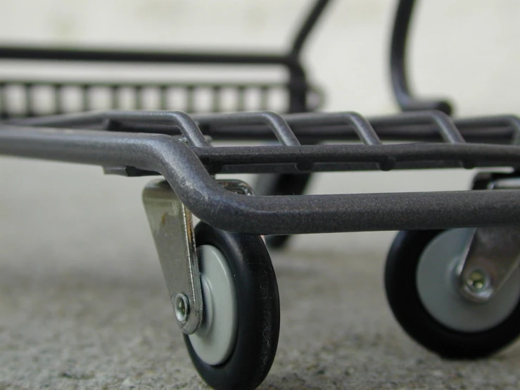 an old fashioned dolly sits on the ground