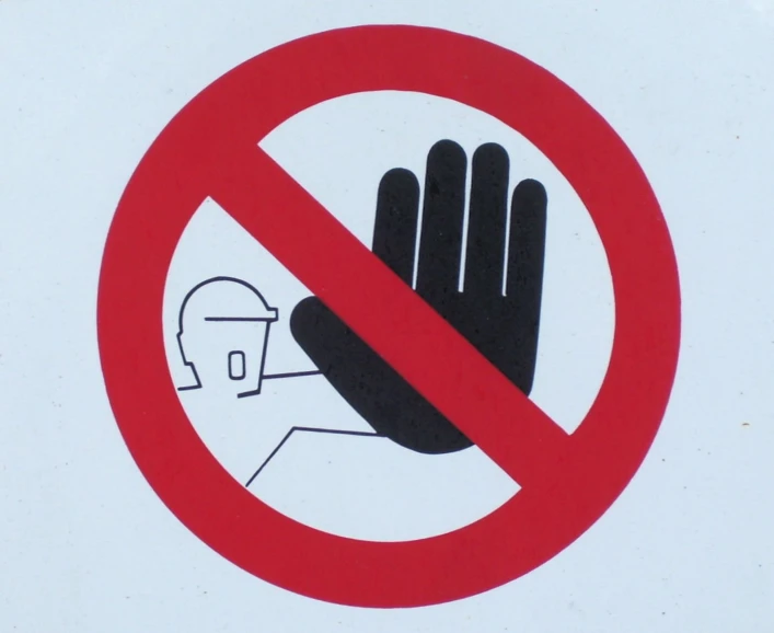 the sign shows a hand is holding a person in his arms