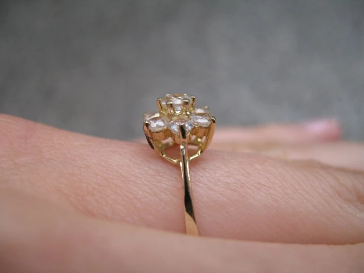 an antique ring is shown on someone's finger