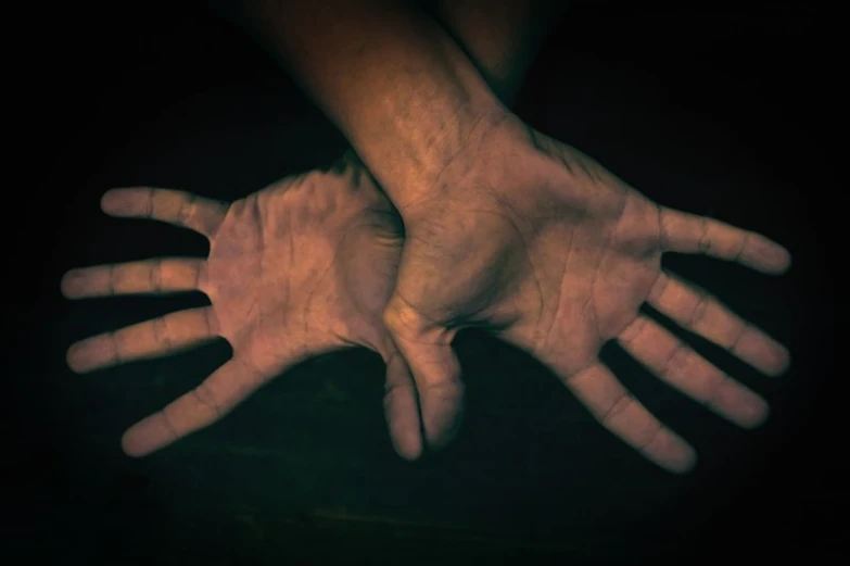 a man and woman holding hands while standing together