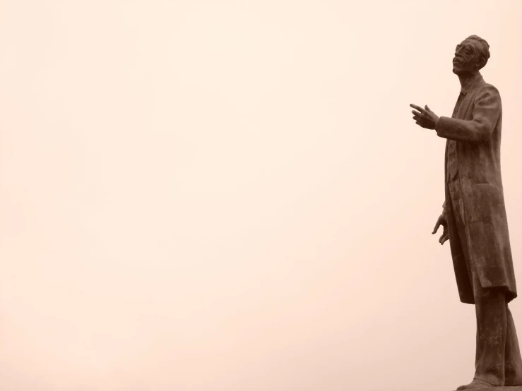 the statue of jesus stands in front of a hazy background