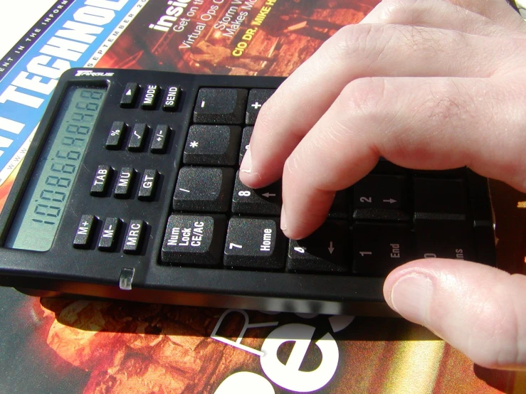 a man typing on a computer with his fingers