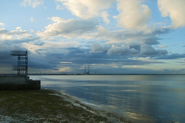 a clock on a structure stands in the water