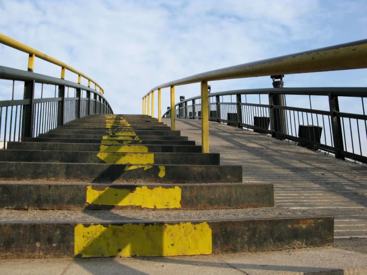 stairs on a bridge lead down to the beach