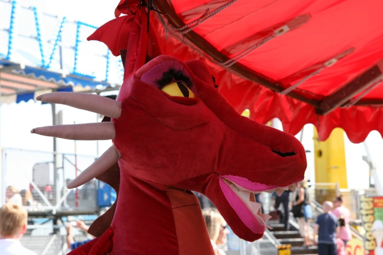 a person is dressed as a dragon at the amut