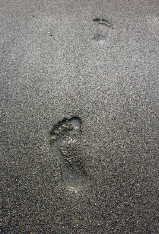 a po of a footprints in the sand