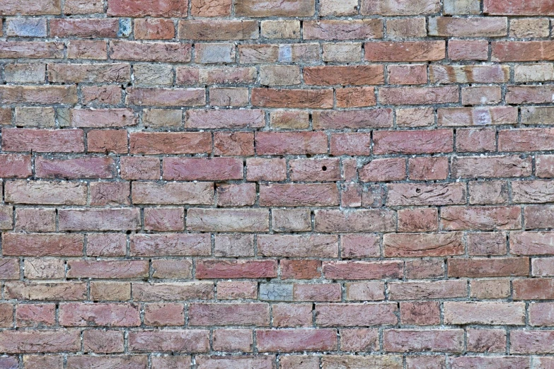 there is a brick wall with some bricks in the middle