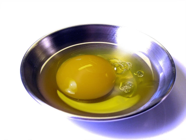 an egg in a bowl on a table