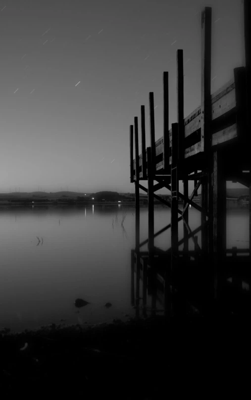 a black and white po of a wooden dock