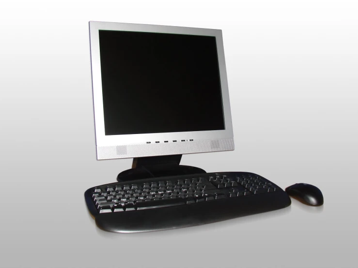 a computer monitor and keyboard in front of a white background