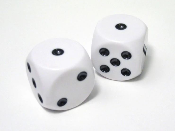two white dices with black dots on the top one with four holes