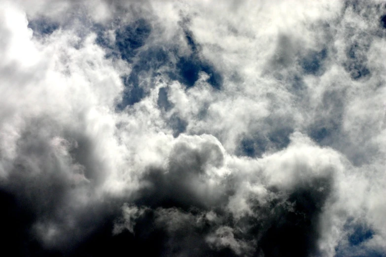 some white clouds are very big in the sky