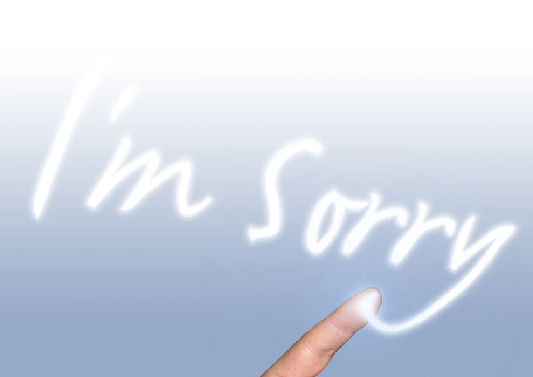 there is a finger that has drawn on the word i'm sorry