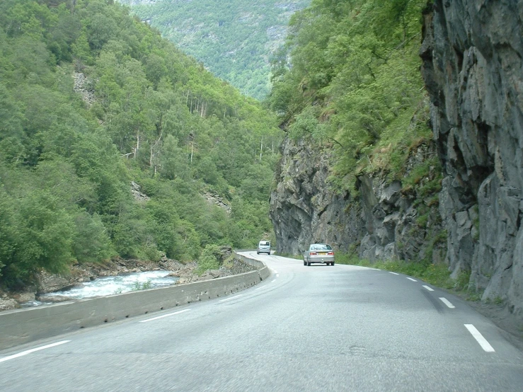 a truck travels down a mountainous road