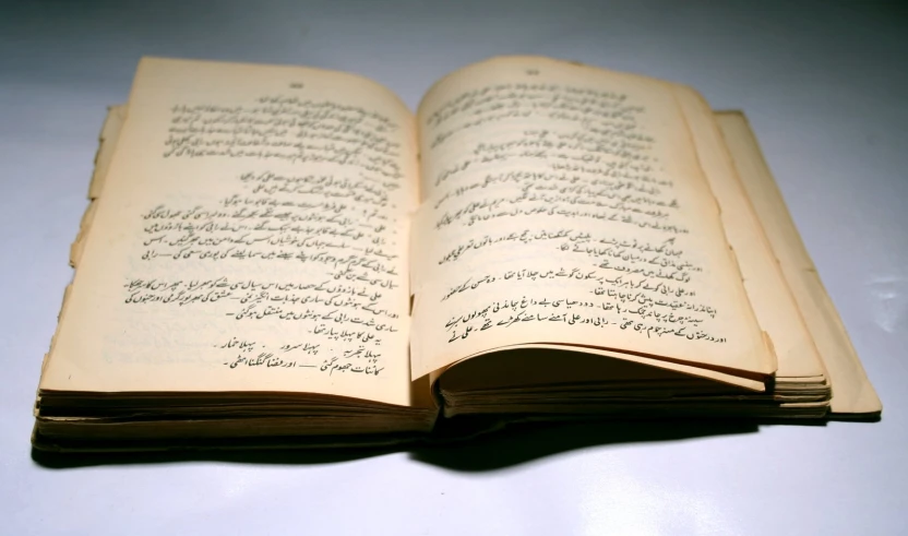 an open book sitting on top of a table