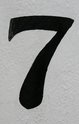 the number seven painted on a white wall