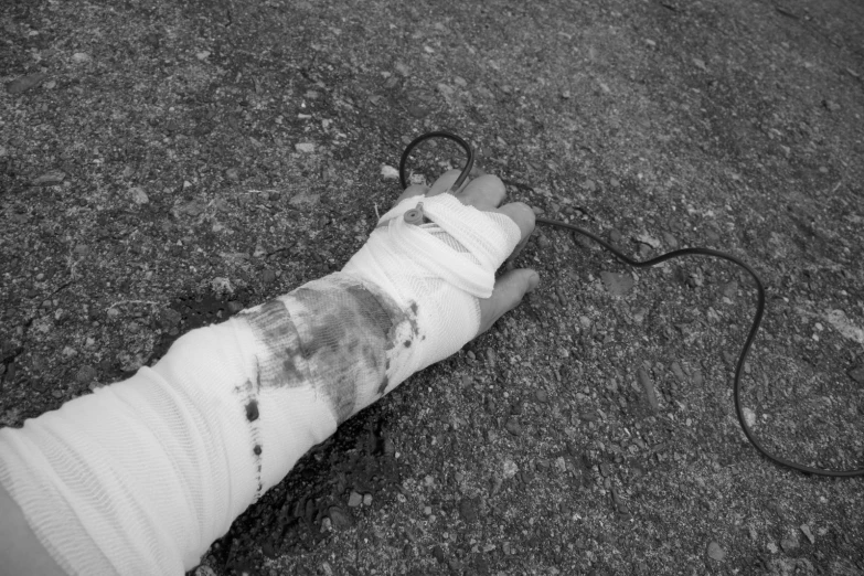 a person with bandages and a black and white pograph