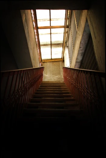 some stairs leading to a roof with bright lighting