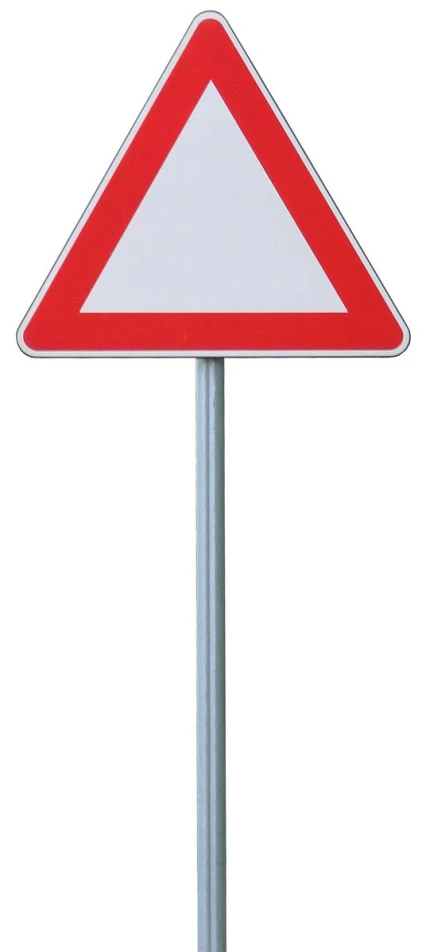 a street sign sits on a silver pole