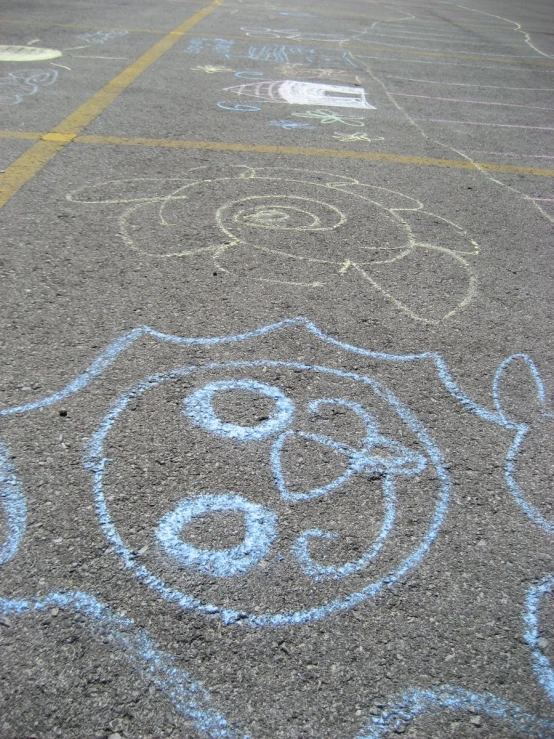 a street with chalk drawings on the pavement