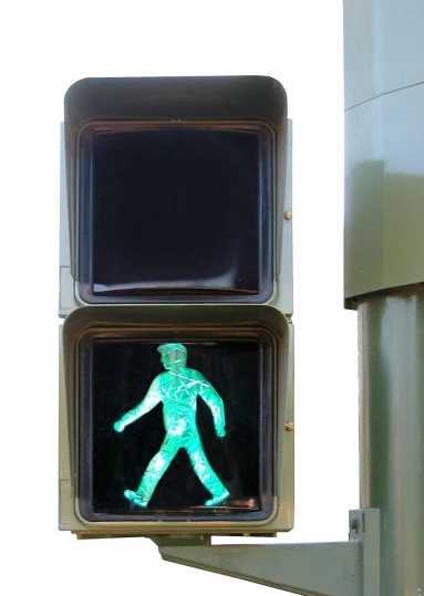 a walk signal is shown with a green pedestrian