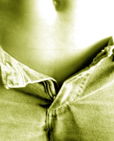a closeup view of the chest and jeans on a pregnant woman