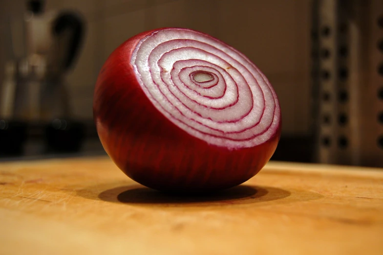 an image of an onion being cut into quarters