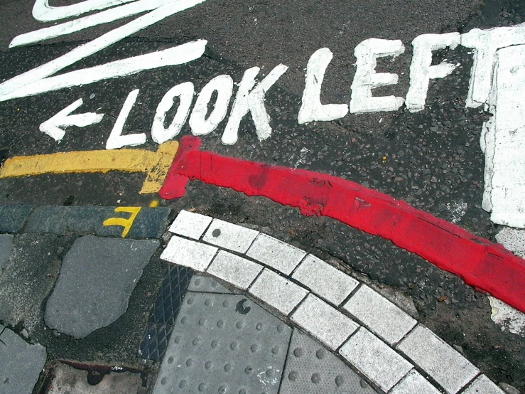 an arrow with the words look left painted on it