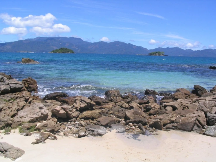 a very pretty beach by some very pretty water