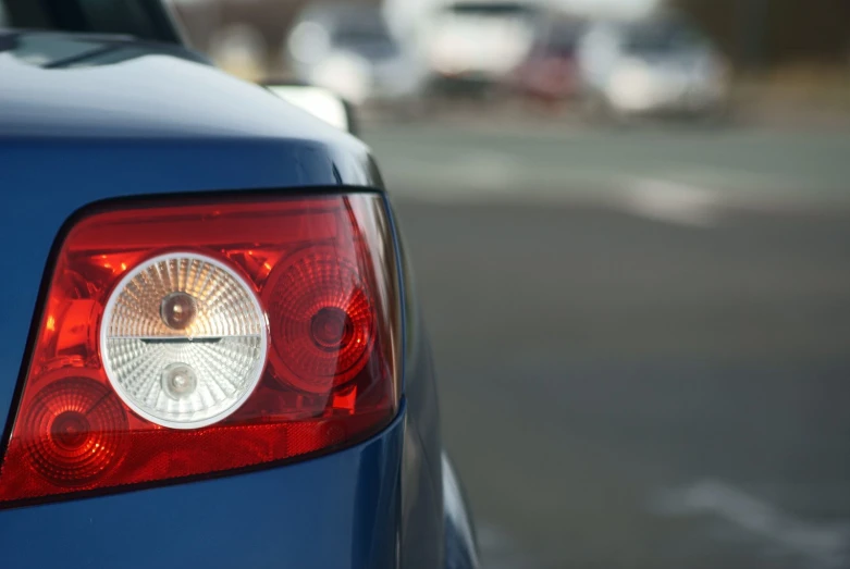 the tail lights of an automobile are visible in this po