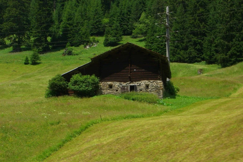 the rustic cabin is on the mountain side