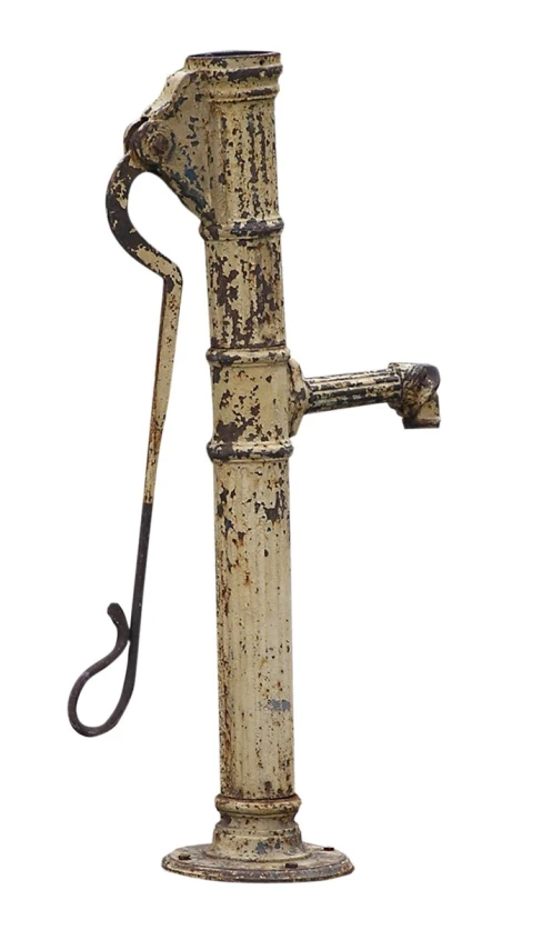 a wooden sculpture with a long handle standing in the snow