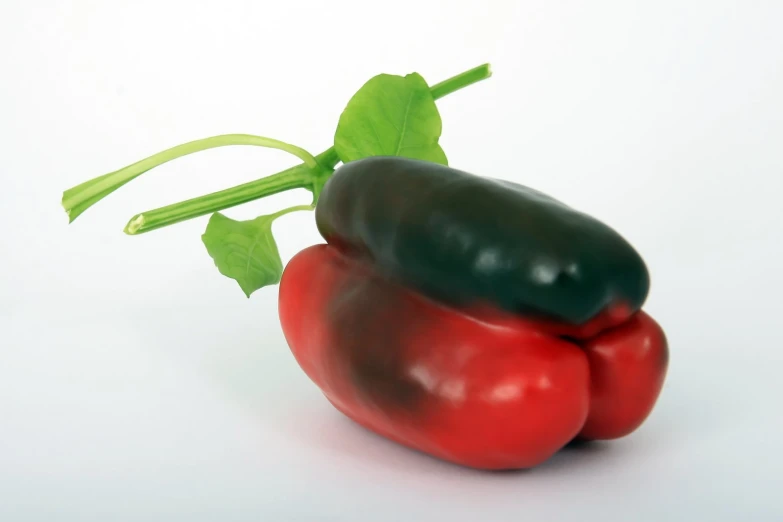 two pieces of green and red pepper next to each other